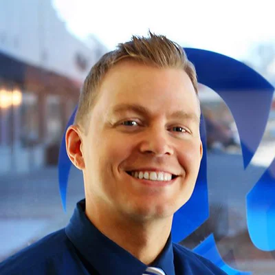 A headshot photo of Dr. Ryan Betzina, a chiropractor at Alpha Spine Health & Injury Center